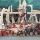 A collection of Warhammer 40,000 Aeldari models, placed on a diorama of alien structures.